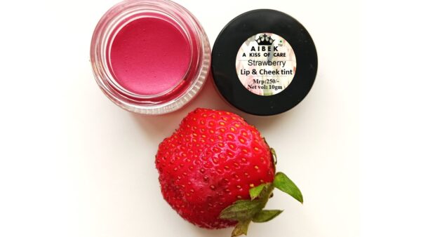 A container of strawberry lip balm, offering moisturizing and nourishing care for soft, smooth lips with a sweet fruity fragrance.